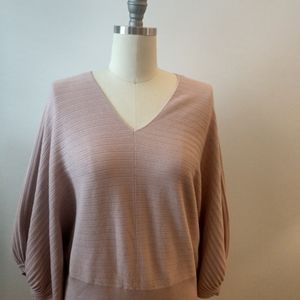 Pink knit dolman sleeve sweater.